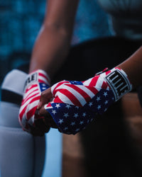 variant:USA flag::TITLE Boxing Print Mexican Style 180" Hand Wraps closeup on boxer's hands