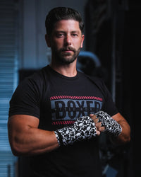 variant:skull and crossbones::TITLE Boxing Print Mexican Style 180" Hand Wraps on boxer's hands