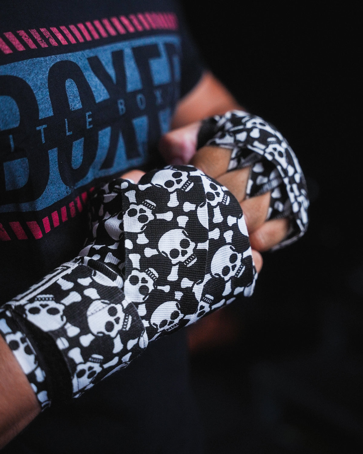 variant:skull and crossbones::TITLE Boxing Print Mexican Style 180" Hand Wraps closeup on boxer's hands