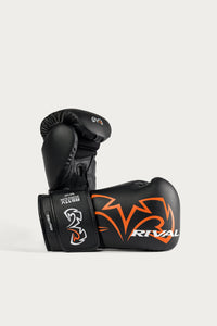 variant:Black::A pair of black Rival boxing gloves with orange and white graphics, displayed on a clean light gray background.