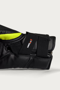 variant:lime/black::Close-up of a black protective boxing glove with a bright neon yellow lining and a black elastic strap featuring the 'WRESTLE Z' logo, set against a light gray background.