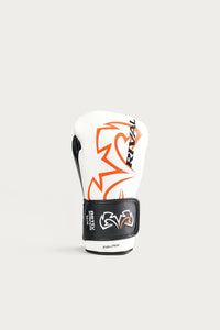 variant:white::A single white boxing glove with black and orange graphics, featuring the RIVAL brand name and logo, set against a solid light gray background.
