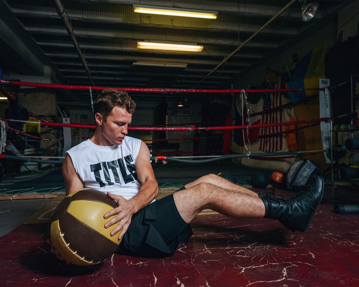 variantl:lifestyle::TITLE Boxing Retro Leather Medicine Balls  guy left  and right ball
