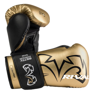 color:Gold::A pair of Rival boxing gloves in metallic gold and black, displayed against a solid white background. The gloves feature the Rival brand logo in black on the gold leather, a black wrist strap with white branding, and a gold knuckle pad.