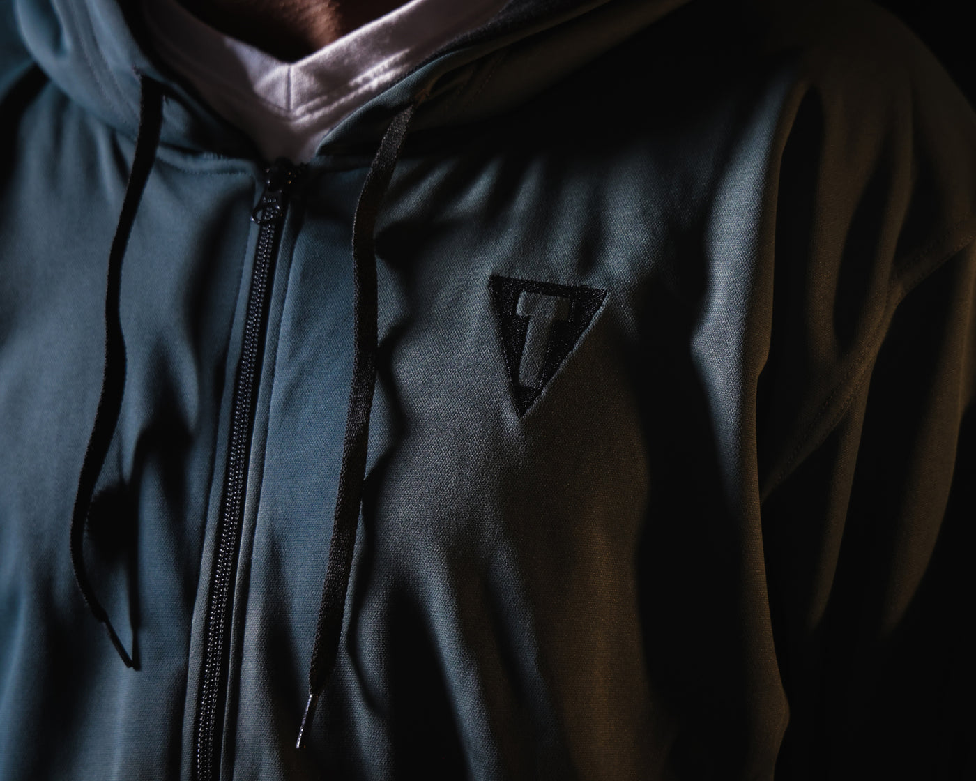 variant:grey/black::TITLE Boxing Thermal Insulated Roadwork Hoodie on athlete closeup