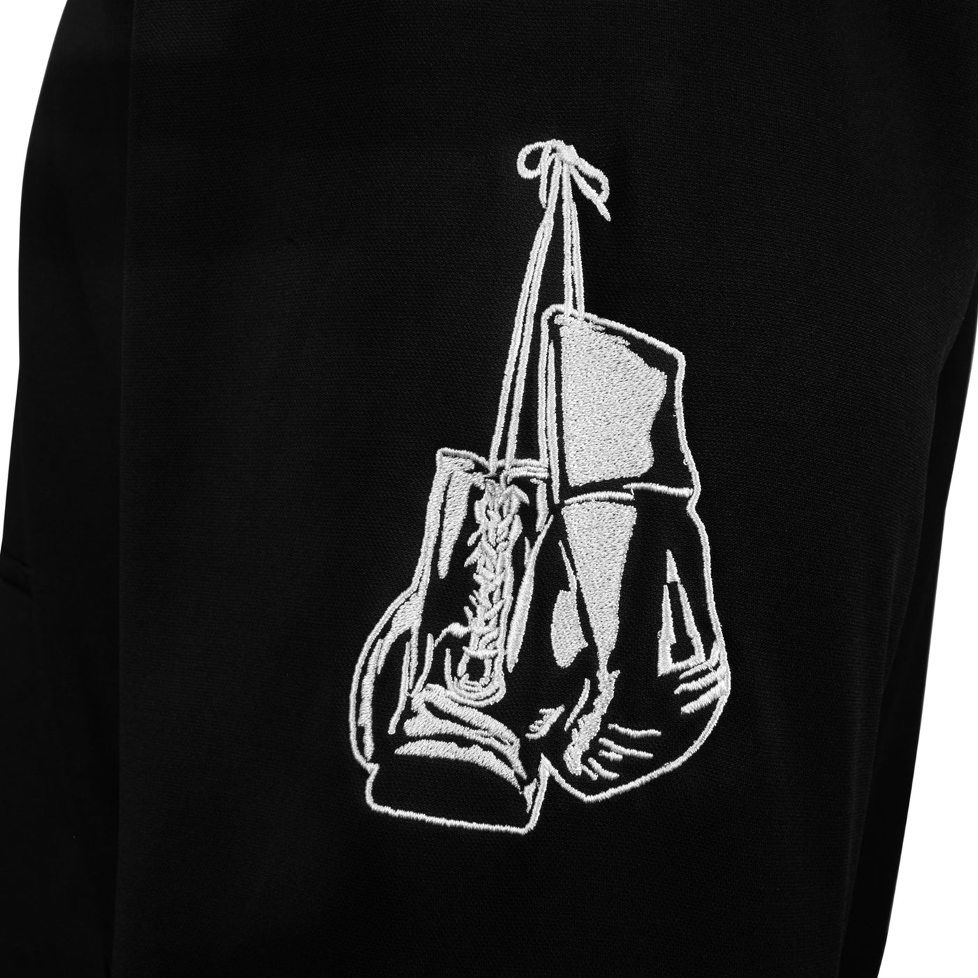 variant:black/white::TITLE Boxing Thermal Insulated Roadwork Hoodie closeup of logo