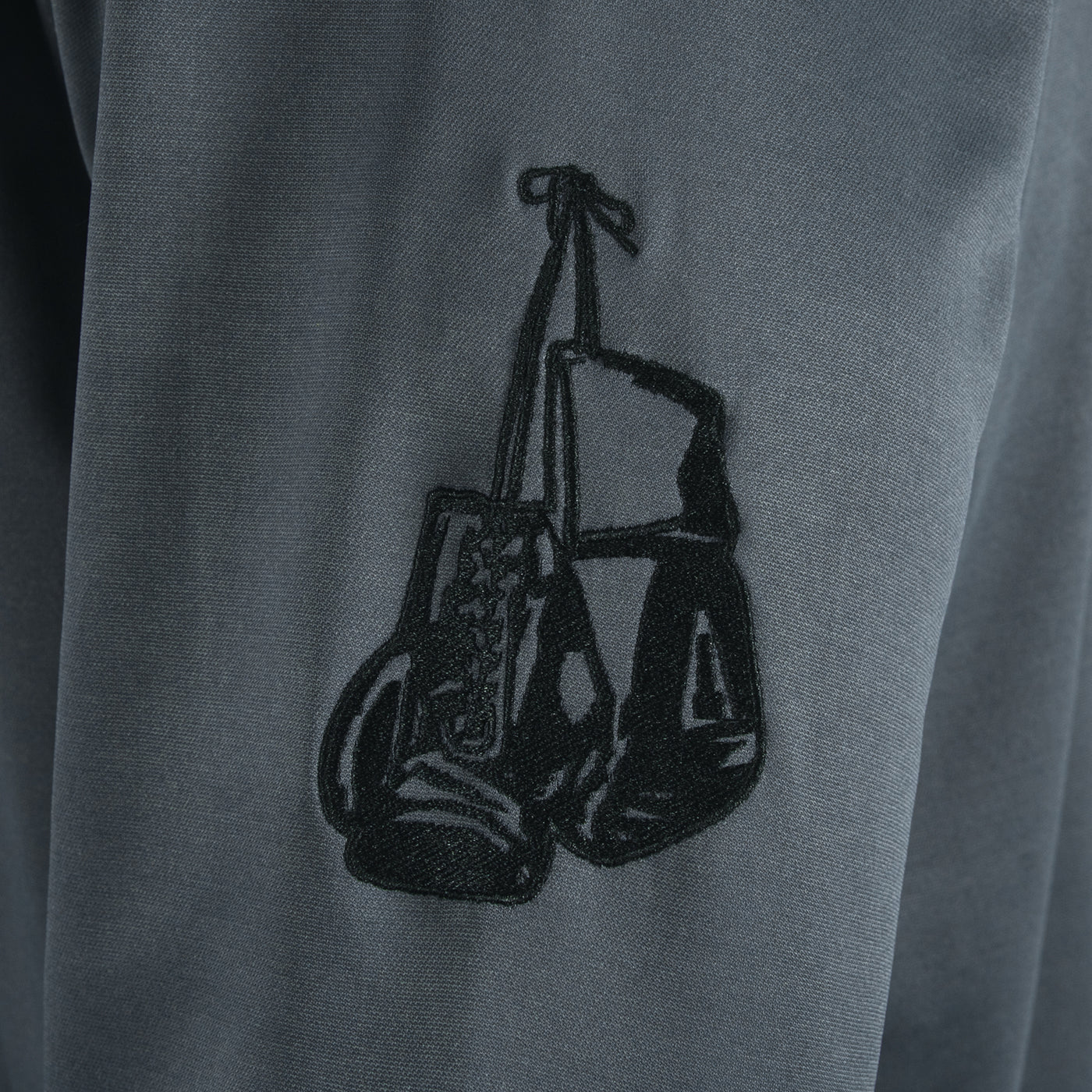 variant:grey/black::TITLE Boxing Thermal Insulated Roadwork Hoodie closeup of logo