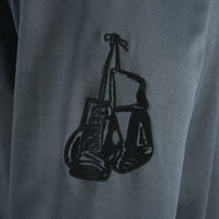 variant:grey/black::TITLE Boxing Thermal Insulated Roadwork Hoodie closeup of logo