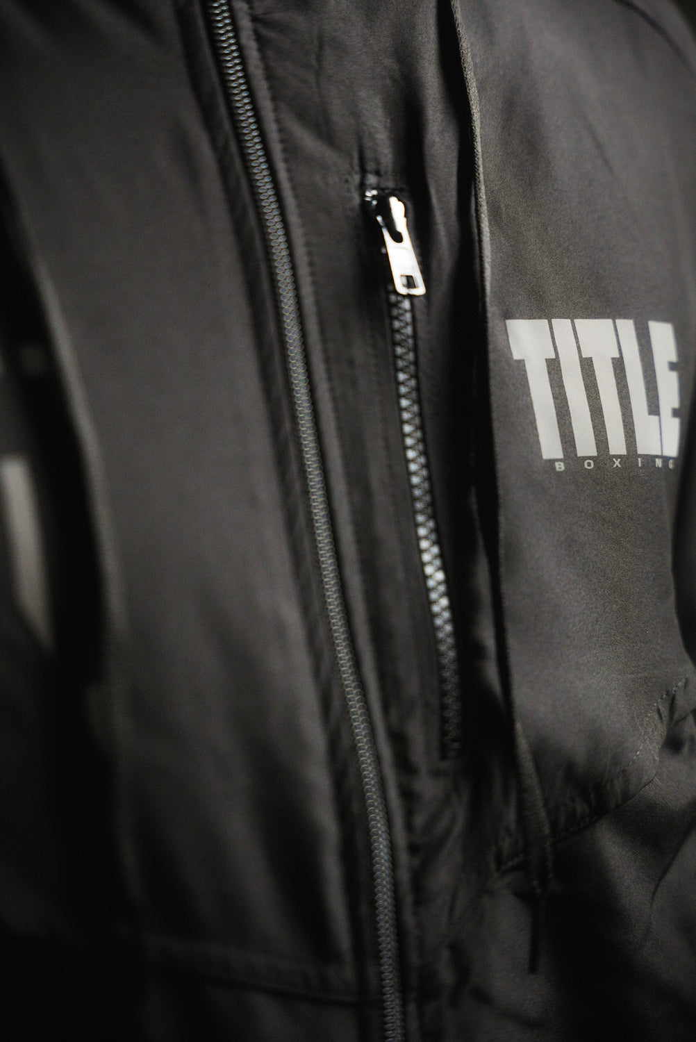 variant:Black::TITLE Boxing Lightweight Road Work Jacket on athlete closeup