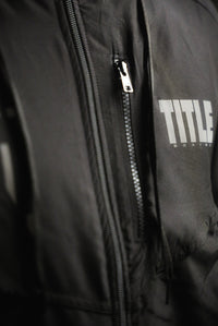 variant:Black::TITLE Boxing Lightweight Road Work Jacket on athlete closeup