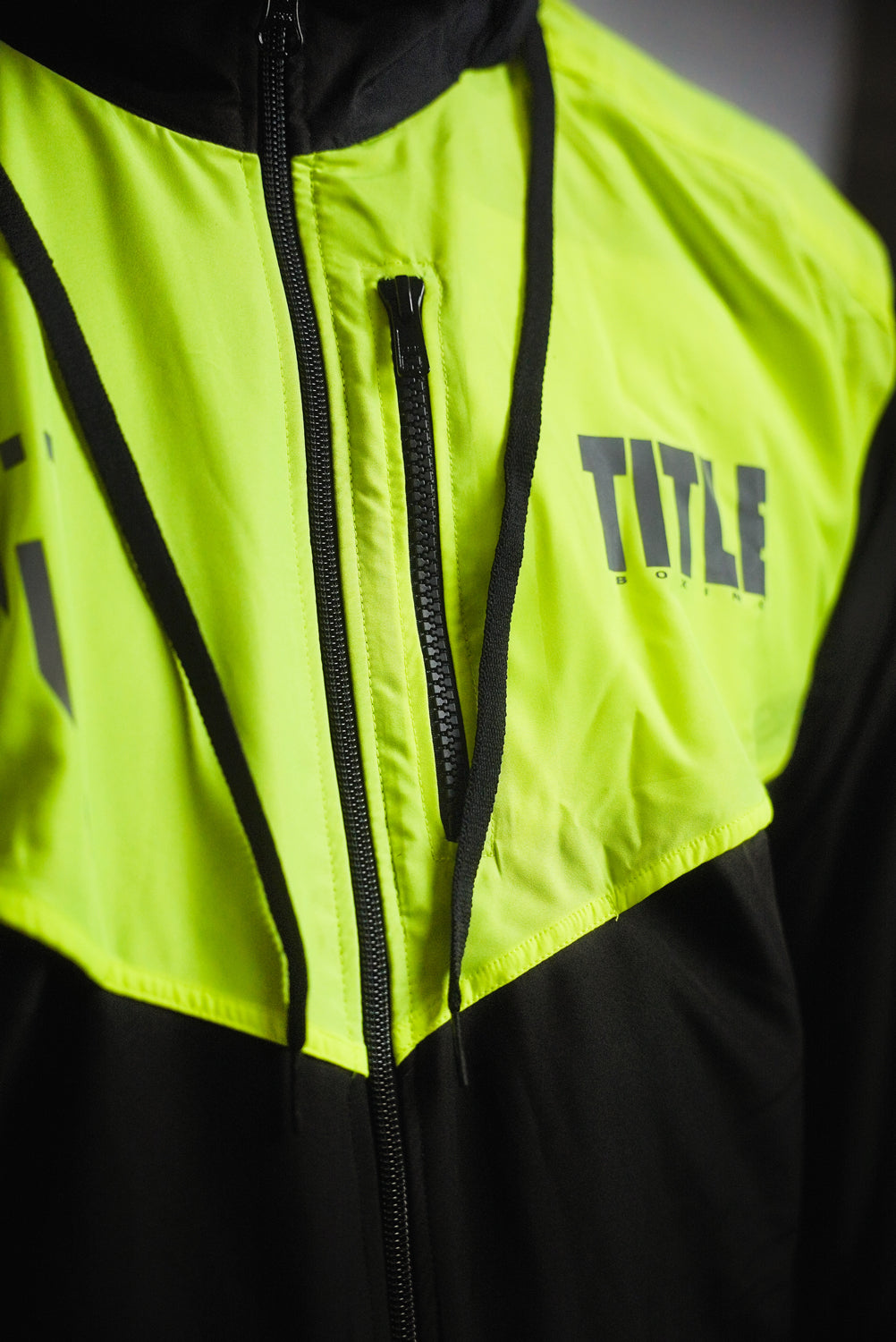 variant:Black/Hi-Vis Yellow::TITLE Boxing Lightweight Road Work Jacket on athlete closeup