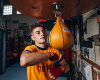 variant:5" x 8"::TITLE Boxing Super Speed Bags guy kitting the speed bag