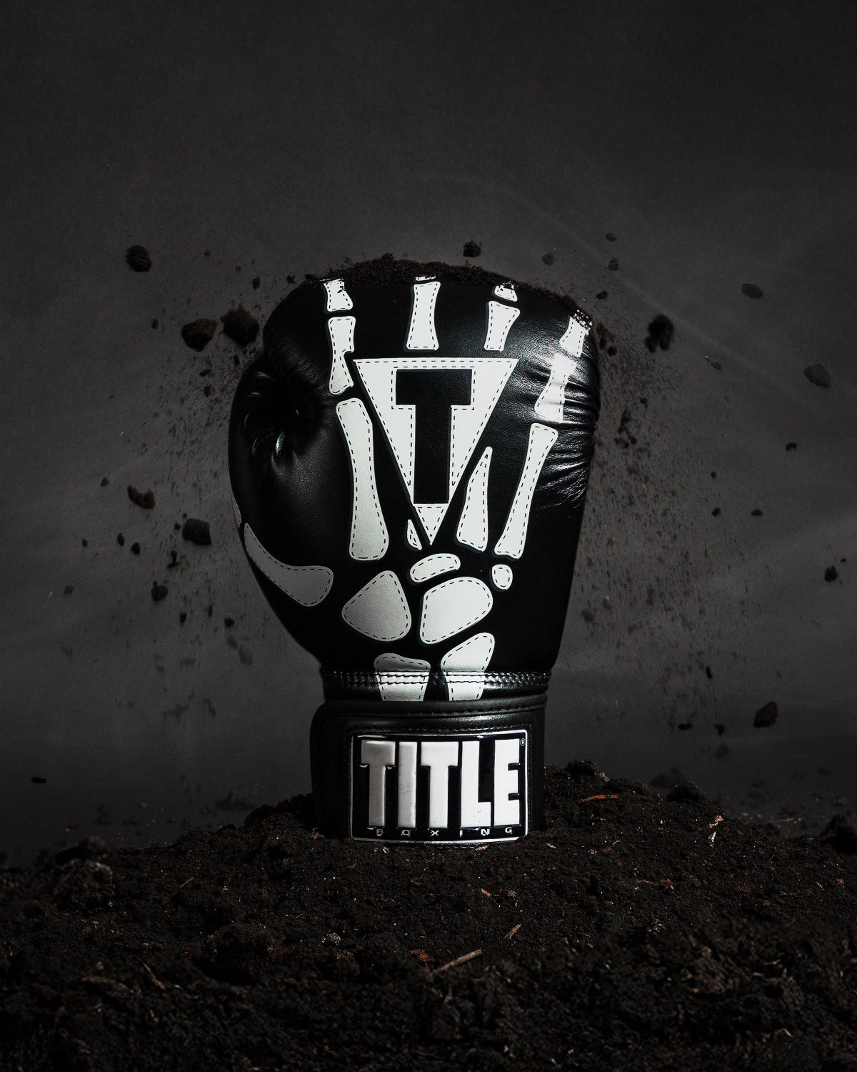 variant:lifestyle::TITLE Boxing Skeleton Hand Bag Gloves single glove view coming out of ground