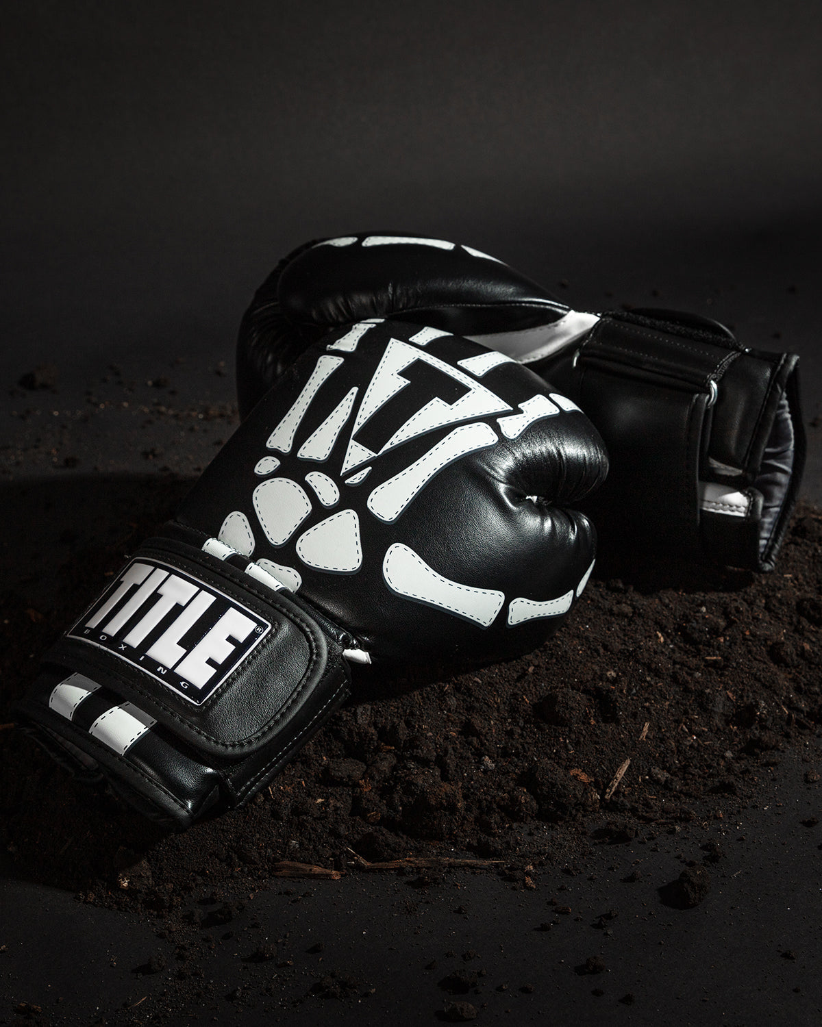 variant:lifestyle::TITLE Boxing Skeleton Hand Bag Gloves side by side view on ground