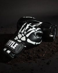 variant:lifestyle::TITLE Boxing Skeleton Hand Bag Gloves side by side view on ground