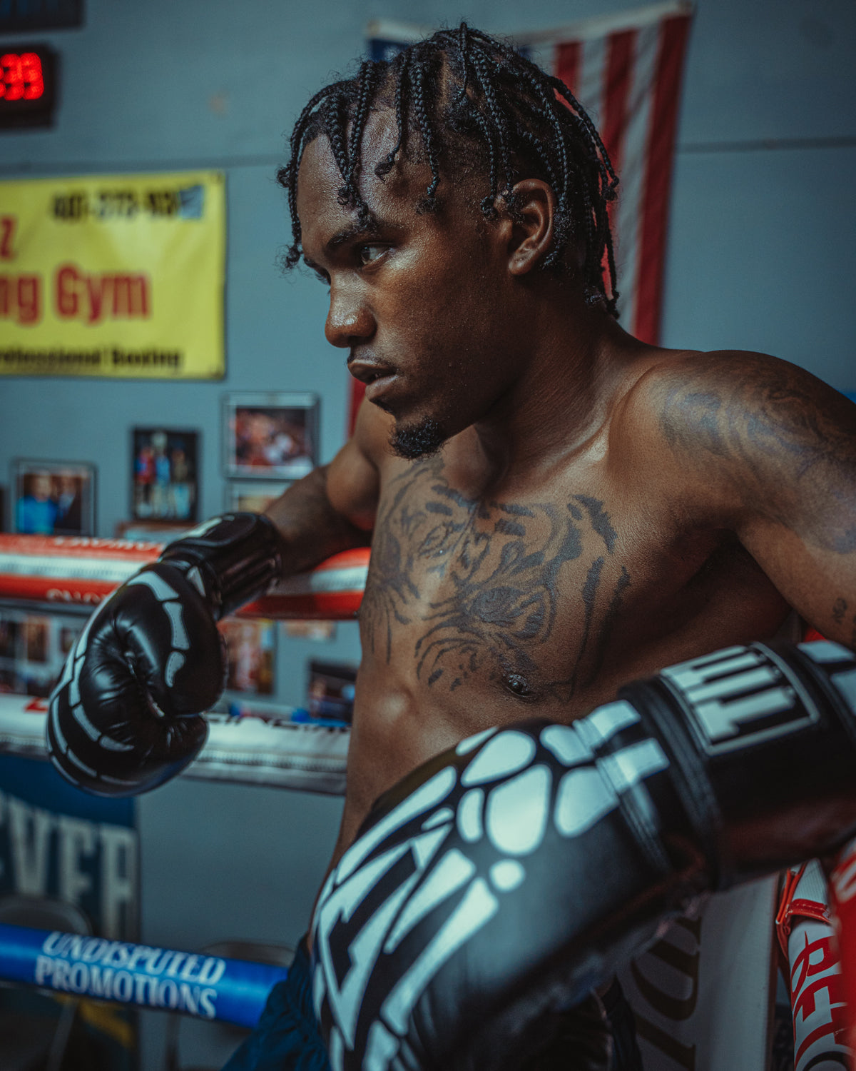 variant:black::TITLE Boxing Skeleton Hand Bag Boxing Gloves on boxer on the  side of a ring