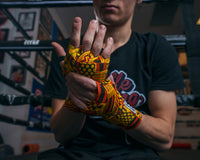 variant:Kente::TITLE Boxing Print Hand Wraps 180"f close up on wraps