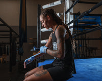 variant:columbia blue::TITLE Boxing Select 180" Semi Elastic Mexican Hand Wraps girl putting on wraps