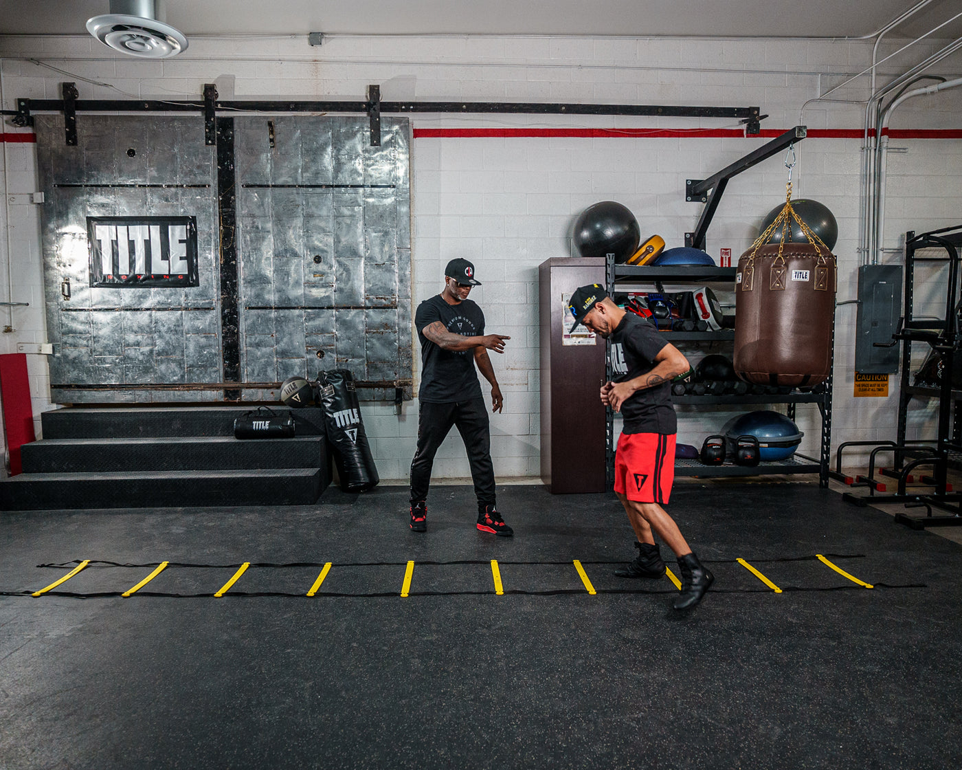 variant:lifestyle::TITLE Boxing Speed & Agility Ladder in use in a boxing gym