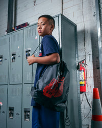 variant:black::TITLE Boxing Bruiser Gym Sack guy wearing