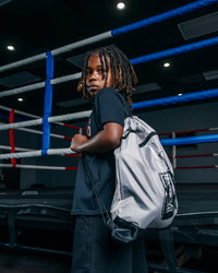 variant:grey::TITLE Boxing Bruiser Gym Sack kid wearing