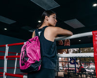 variant:pink::TITLE Boxing Bruiser Gym Sack girl wearing bag
