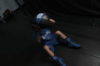 variant:8 lbs::TITLE Boxing Rubber Medicine Ball guy lifting over head