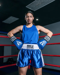 variant:blue::TITLE Boxing Aerovent Elite Racerback Boxing Jersey 2.0 girl in ring hands on hips