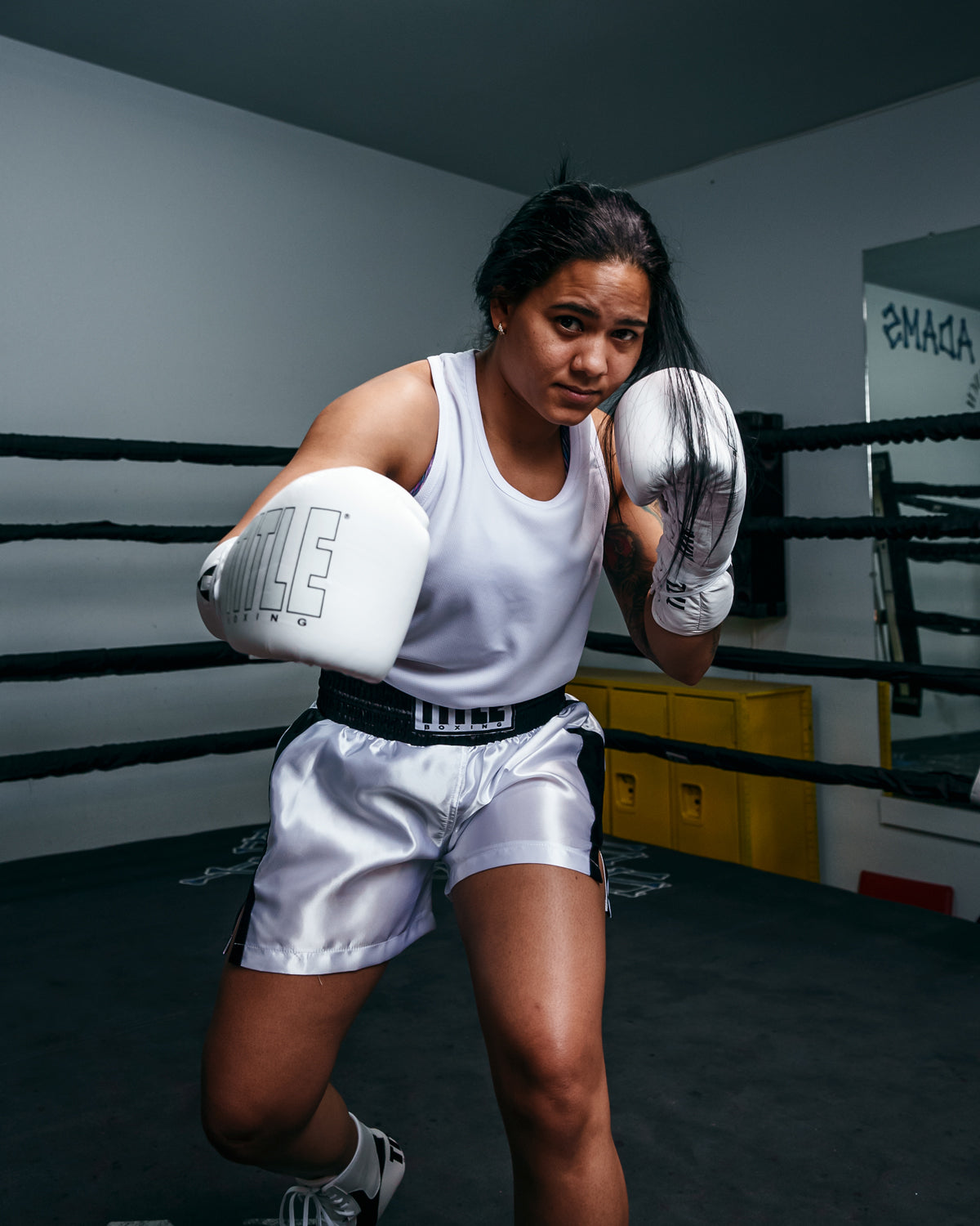 variant:white::TITLE Boxing Aerovent Elite Racerback Boxing Jersey 2.0 girl in ring