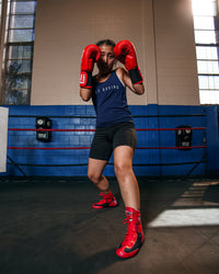 variant:Red/Black::TITLE Boxing Speed-Flex Encore Mid-Top Shoes boxing stance