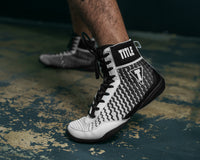 variant:Black/White::TITLE Boxing Predator II Shoes 2.0 guy in shoes left foot down