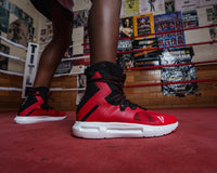 variant:red/black::TITLE Boxing High Point Boxing Shoes guy standing in ring with sh oes