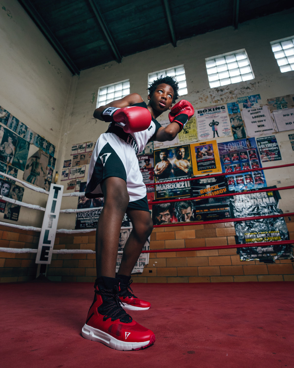 variant:red/black::TITLE Boxing High Point Boxing Shoes guy boxing stance to right