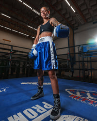 variant:blue/white::TITLE Boxing Edge Boxing Trunks 2.0 girl in ring