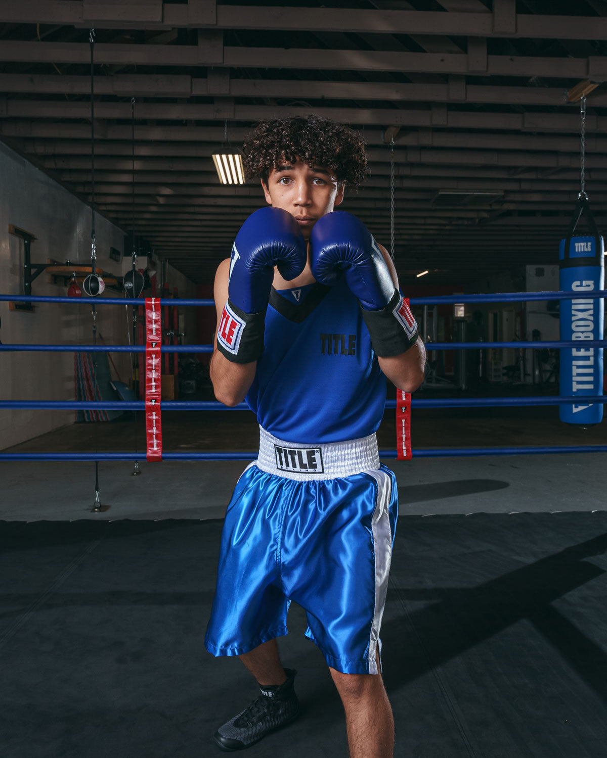 variant:blue/white::TITLE Boxing Edge Boxing Trunks 2.0 boxing pose hands up