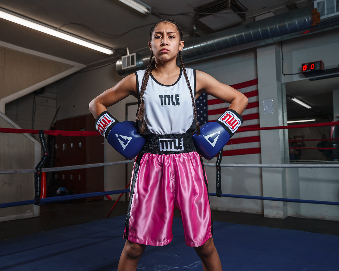 variant:pink/black::TITLE Boxing Edge Boxing Trunks 2.0 girl standing in ring