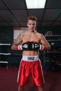 variant:red/white::TITLE Boxing Edge Boxing Trunks 2.0 guy touching gloves