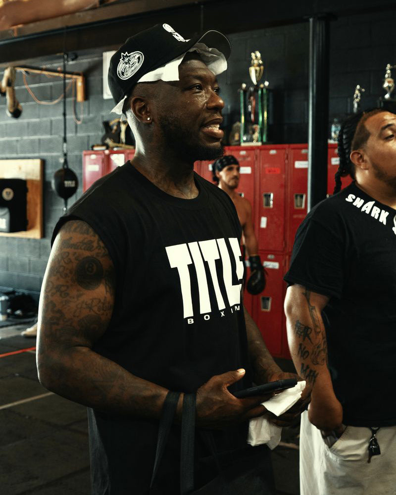 variant:Black/White::TITLE Boxing Iconic Block Muscle Tee on boxer in the gym
