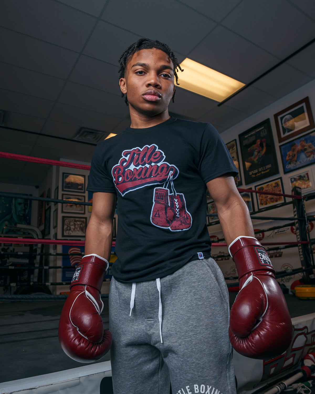 variant:black::TITLE Boxing Classic Script Performance Tee kid wearing gloves 