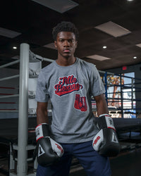 variant:grey::TITLE Boxing Classic Script Performance Tee kid sitting on ring