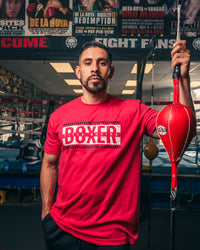variant:Red::TITLE Boxing Distressed Boxer Tee guy posing holding double end bag cord