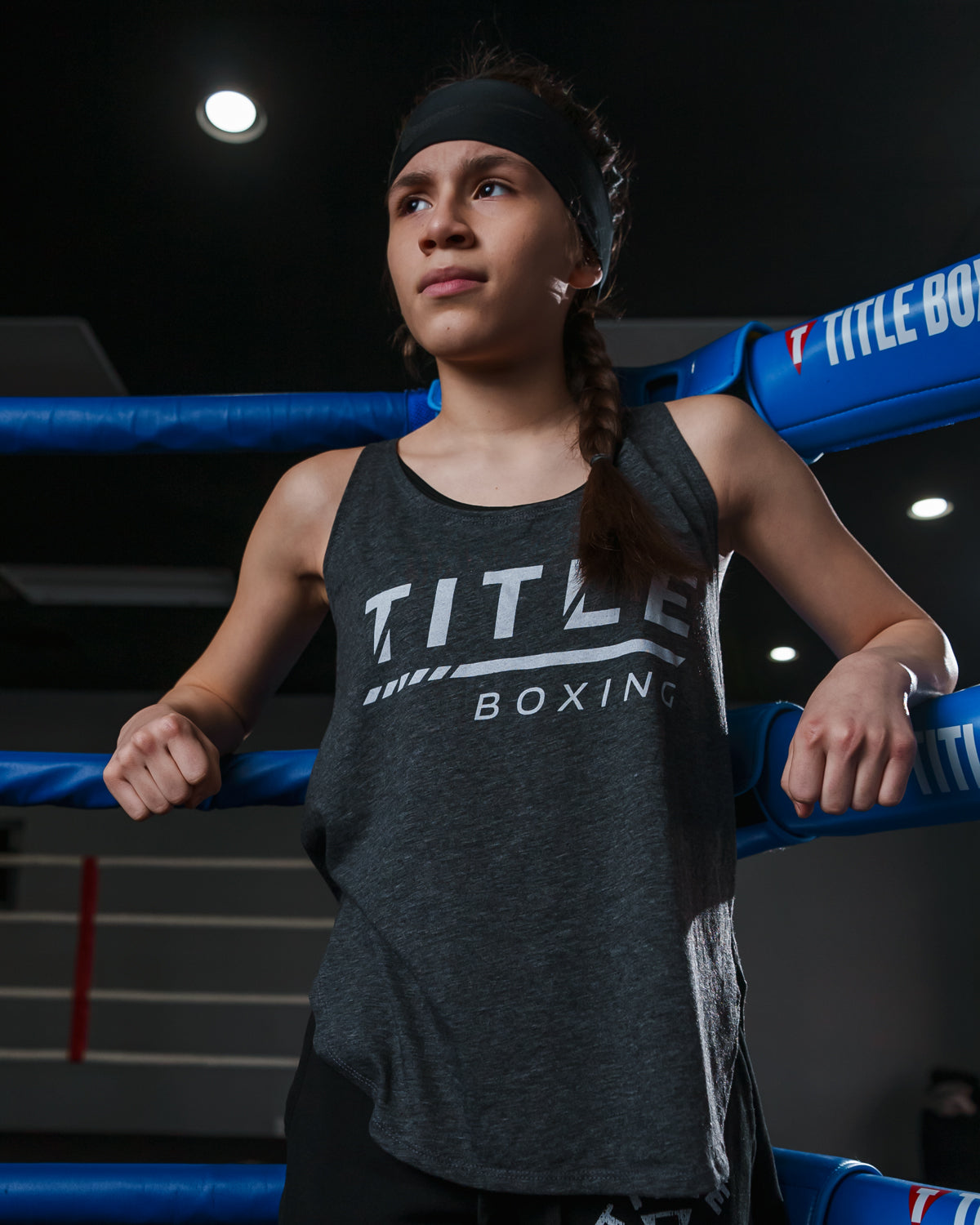 variant:charcoal::TITLE Boxing Women's striped Wordmark Cropped Tank girl in ring