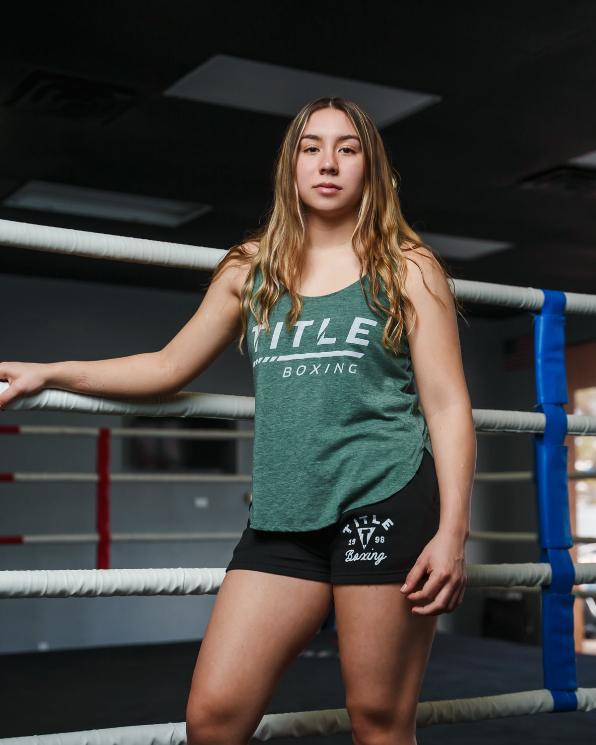 variant:green::TITLE Boxing Women's Striped Wordmark Cropped Tank girl in ring