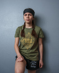 variant:green::TITLE Boxing Women's Snapshot tee girl standing on wall