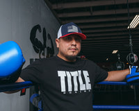 variant:red/white/blue::TITLE Boxing Pride Adjustable Mesh Cap coach in corner of ring with mitts