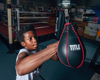 variant:lifestyle::TITLE Boxing Gyro Balanced Leather Speed Bag kid hitting bag