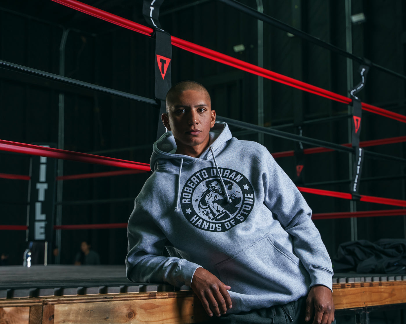 variant:Grey::TITLE Boxing Legacy Roberto Duran "Hands of Stone" Hoodie guy posing on the ring