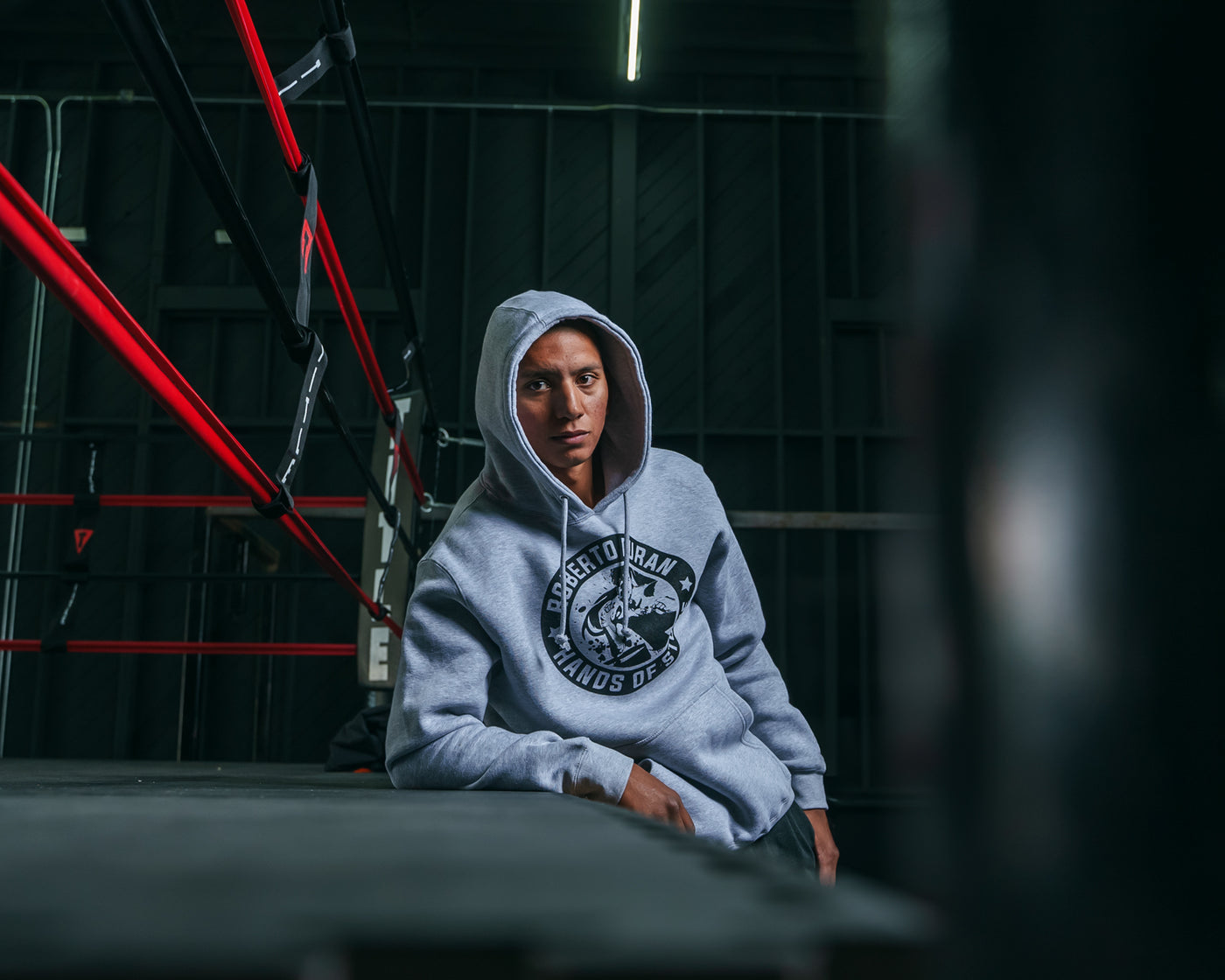 variant:Grey::TITLE Boxing Legacy Roberto Duran "Hands of Stone" Hoodie guy posing on the ring