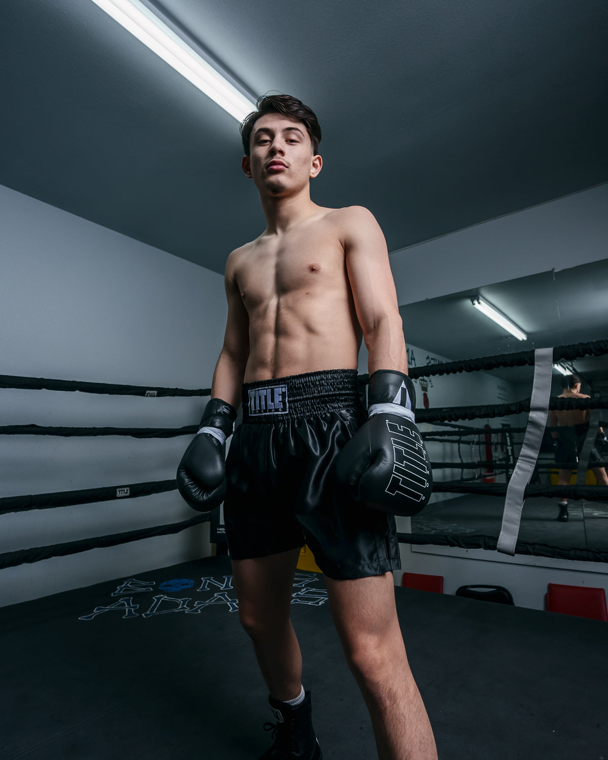 variant:black/black::TITLE Boxing Professional Traditional Cut Trunks guy in ring hands down