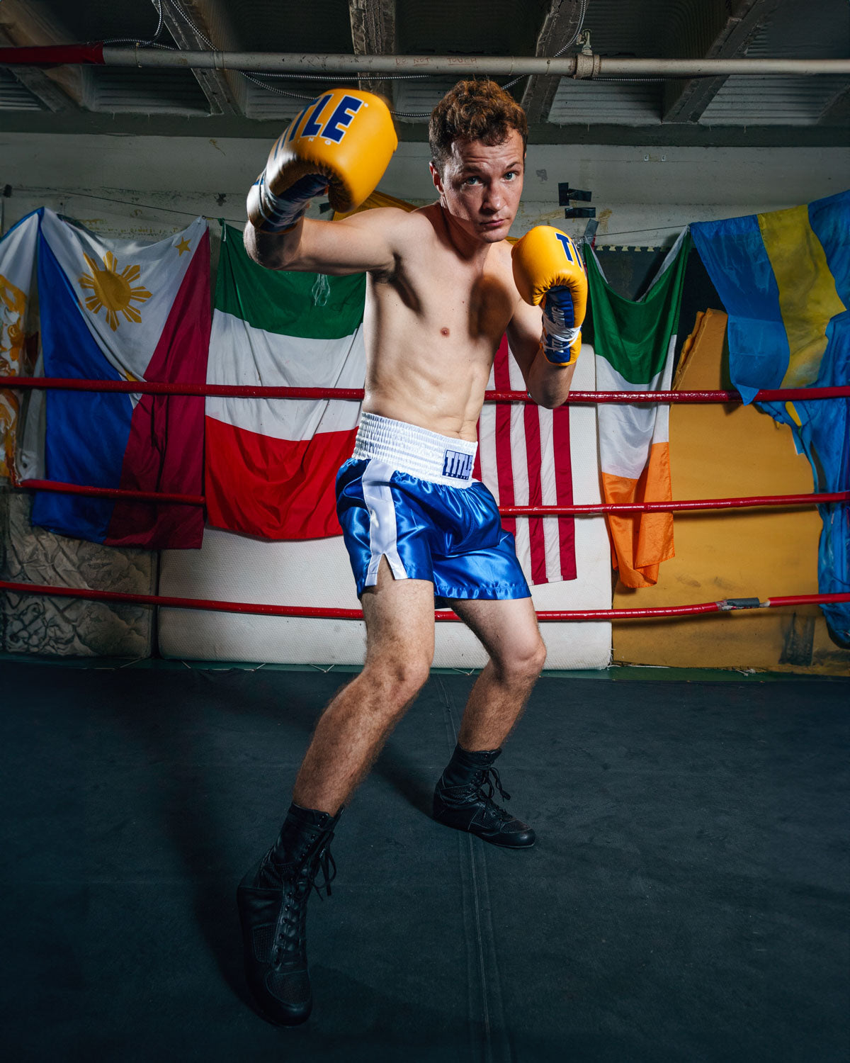 variant:blue/white::TITLE Boxing Professional Traditional Cut Trunks boxing right hook yellow gloves